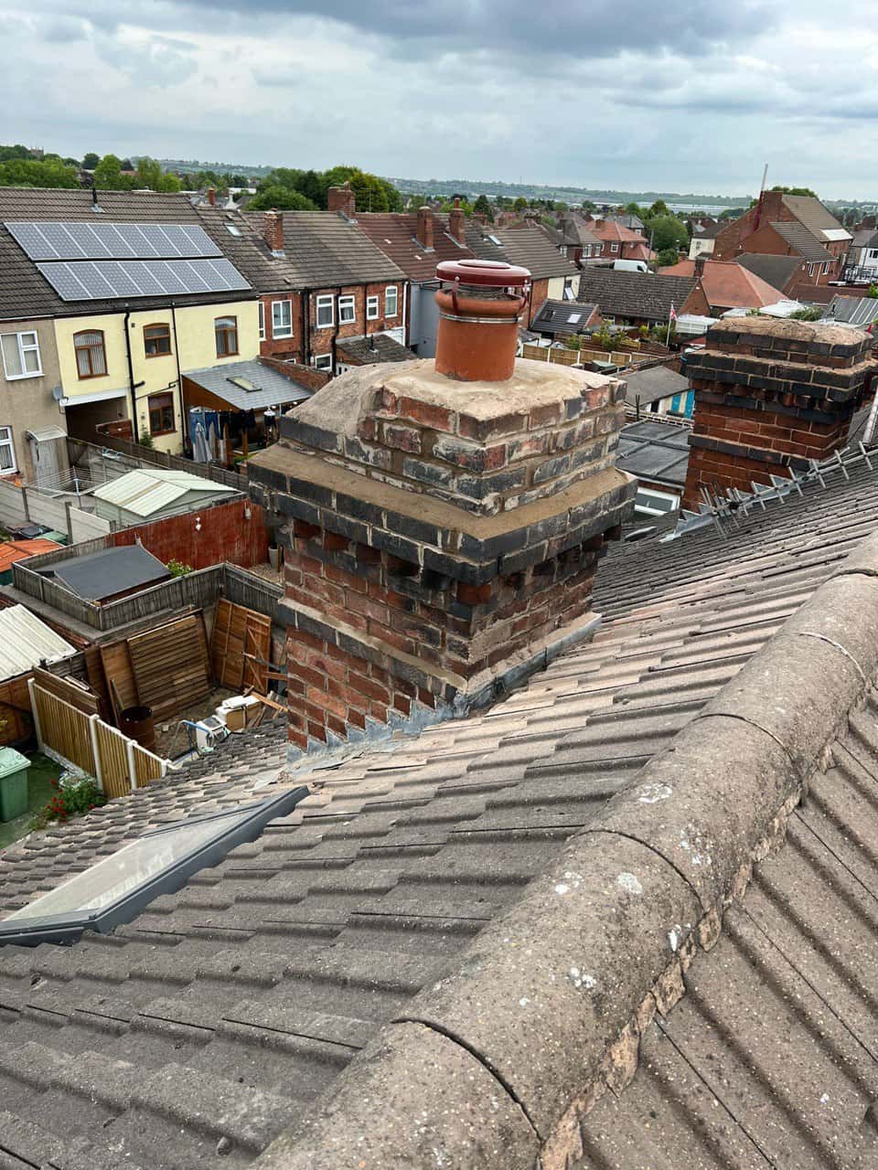 This is a photo taken from a roof which is being repaired by Gosport Roofing Repairs, it shows a street of houses, and their roofs