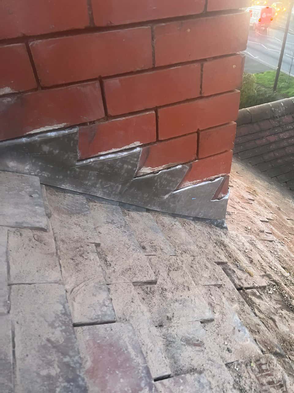 This is a photo of new leadwork being installed around an old chimney. Works carried out by Gosport Roofing Repairs